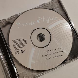 CD - Sandra Olajide – Ain't It A Shame
